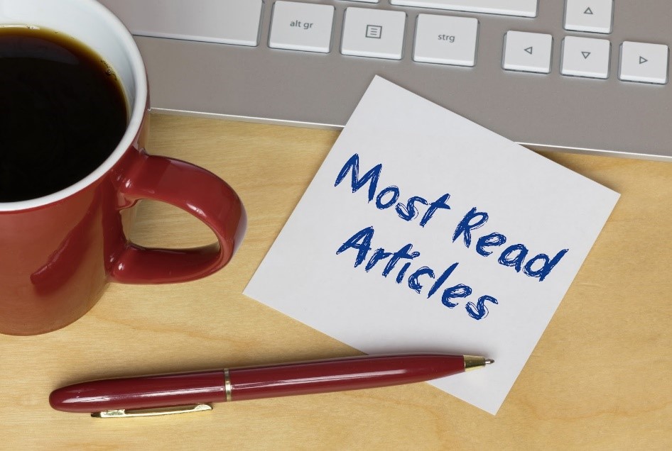 Stock photo of a coffee cup and notepad saying "Most Read Articles"